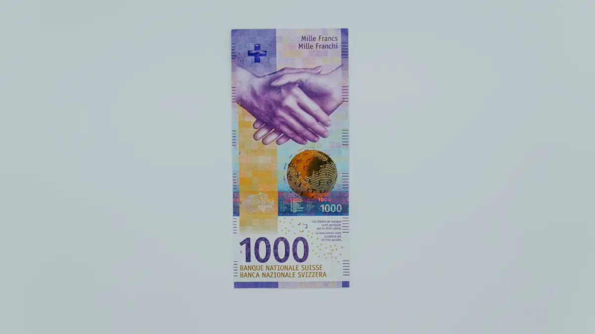 On a money note, there's a picture of 2 people shaking hands