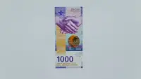 On a money note, there's a picture of 2 people shaking hands
