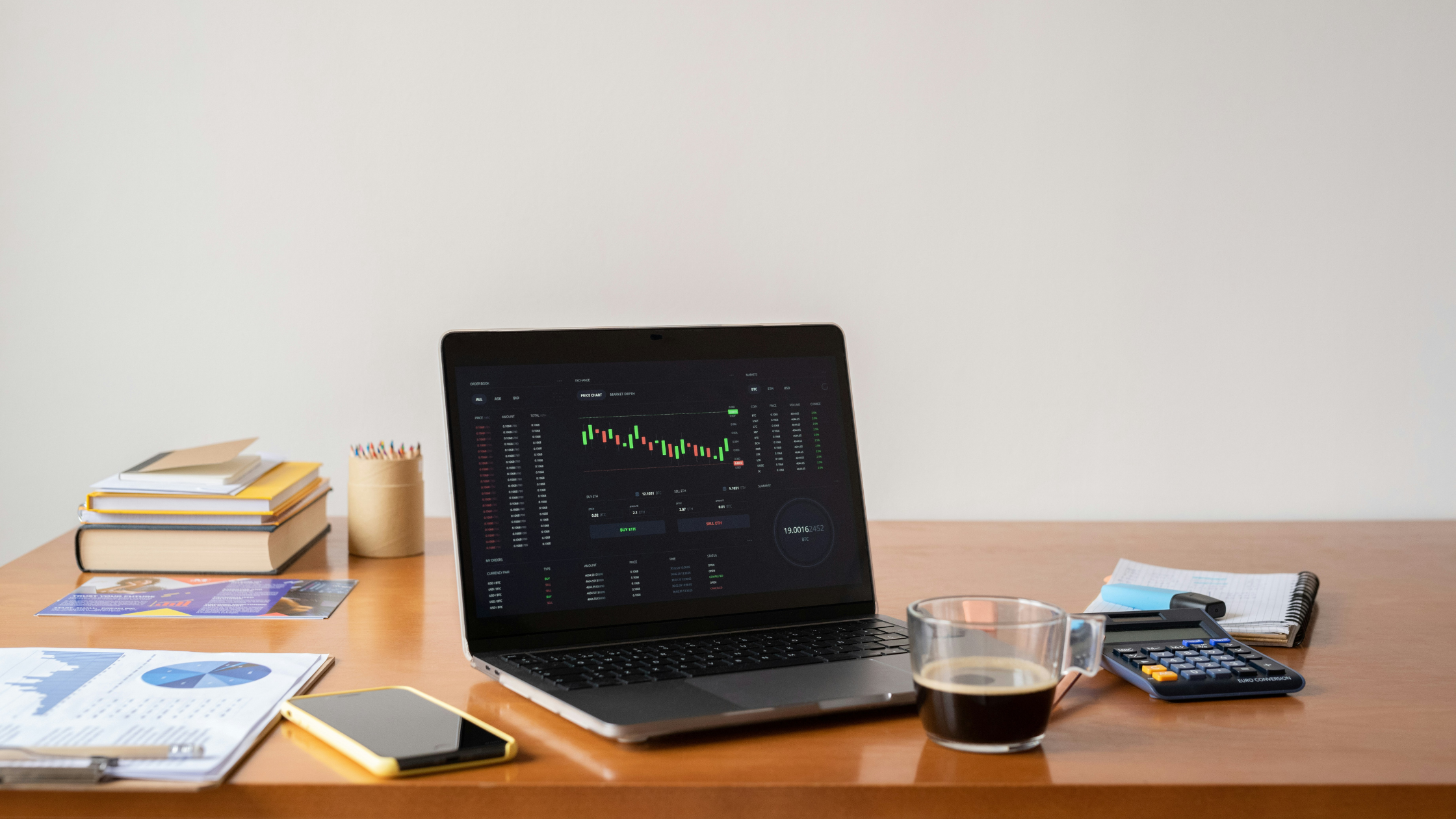 A laptop screen with a financial graph on it