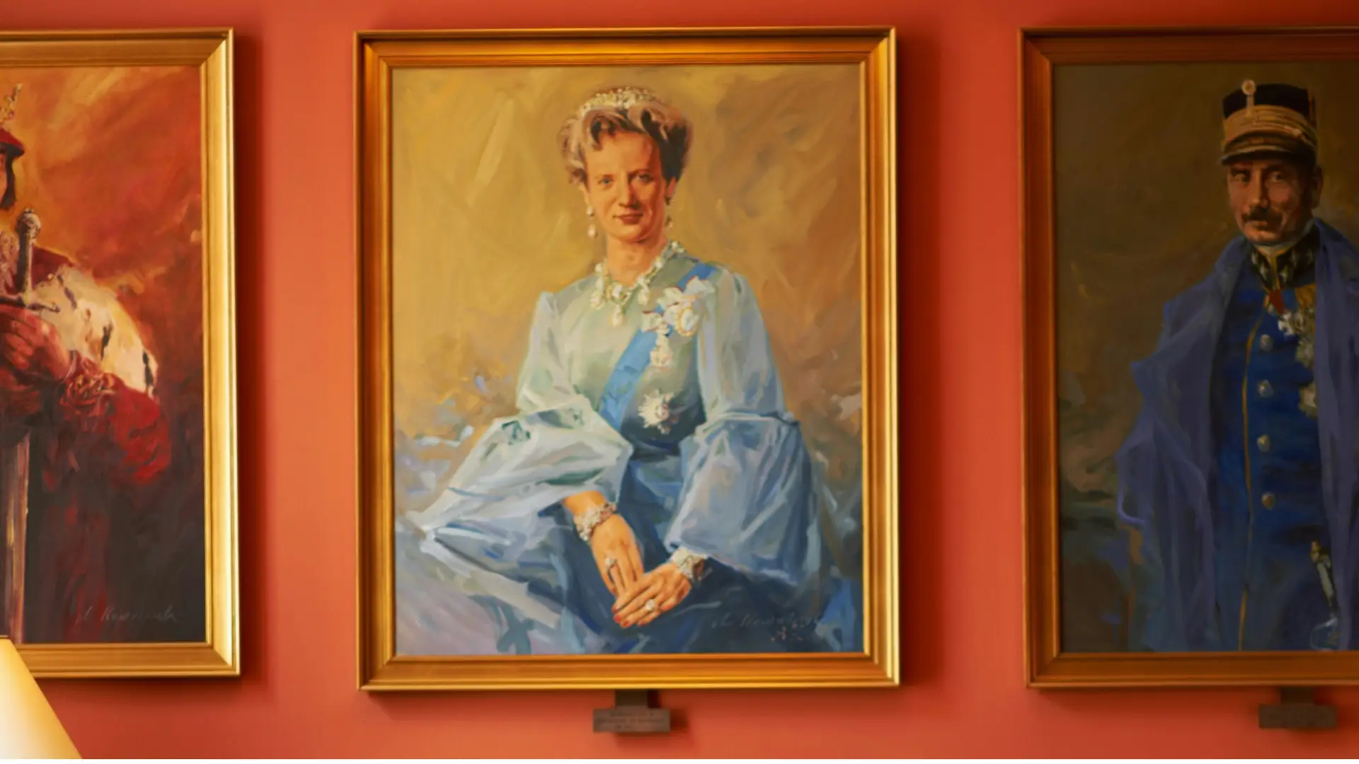 A row of paintings on a wall