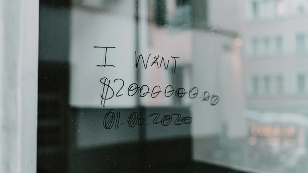 Someone has written 'I want $2000000' on a window in sharpie
