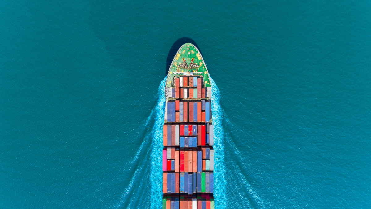 A transportation boat in the middle of a blue ocean
