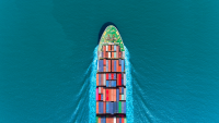 A transportation boat in the middle of a blue ocean