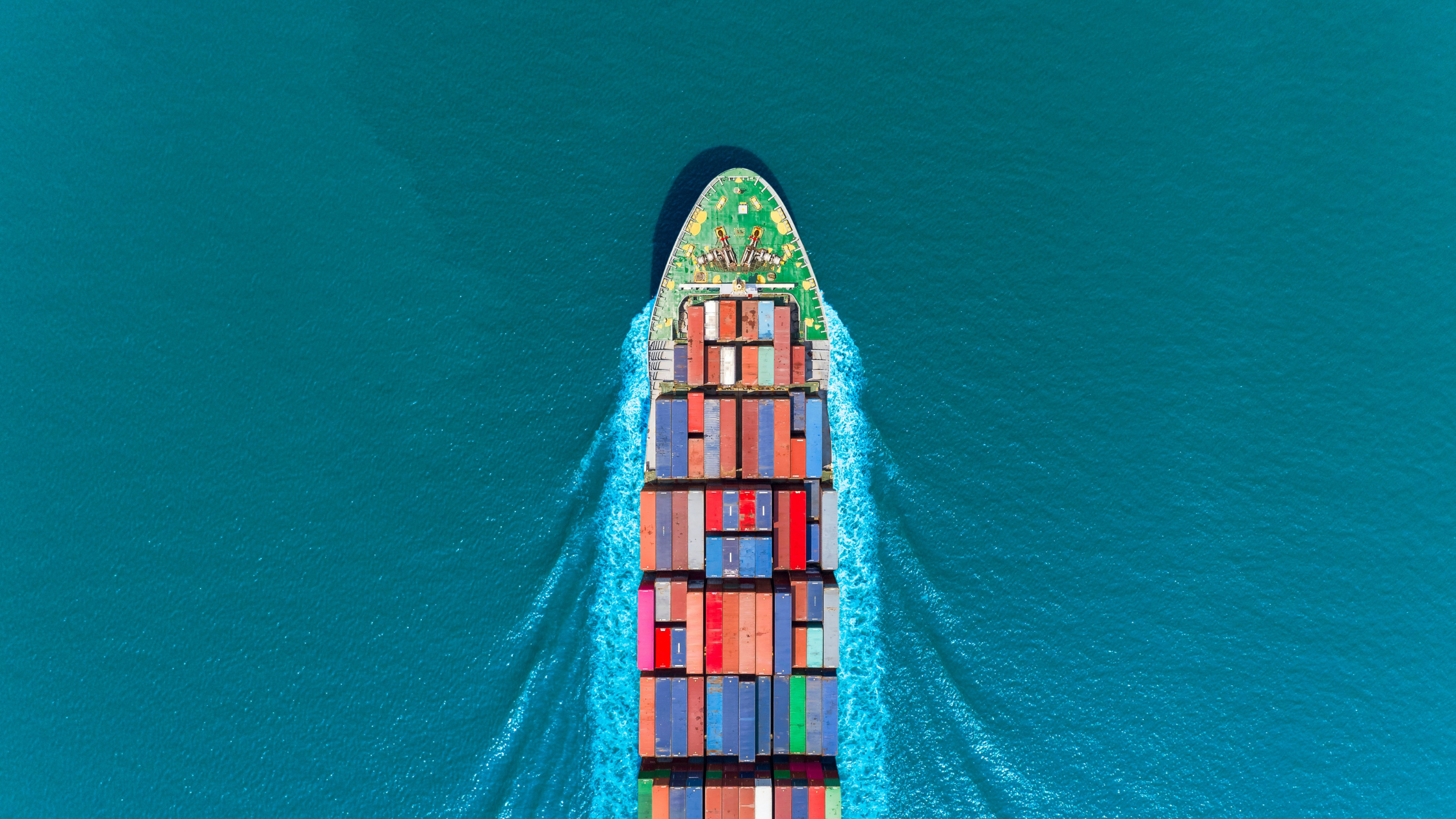 A transportation boat in the middle of a blue ocean