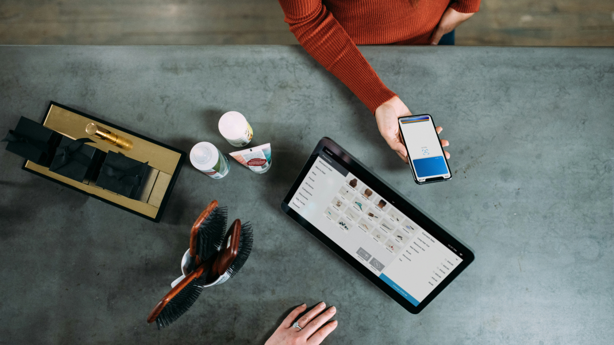 A person making a payment through a money app