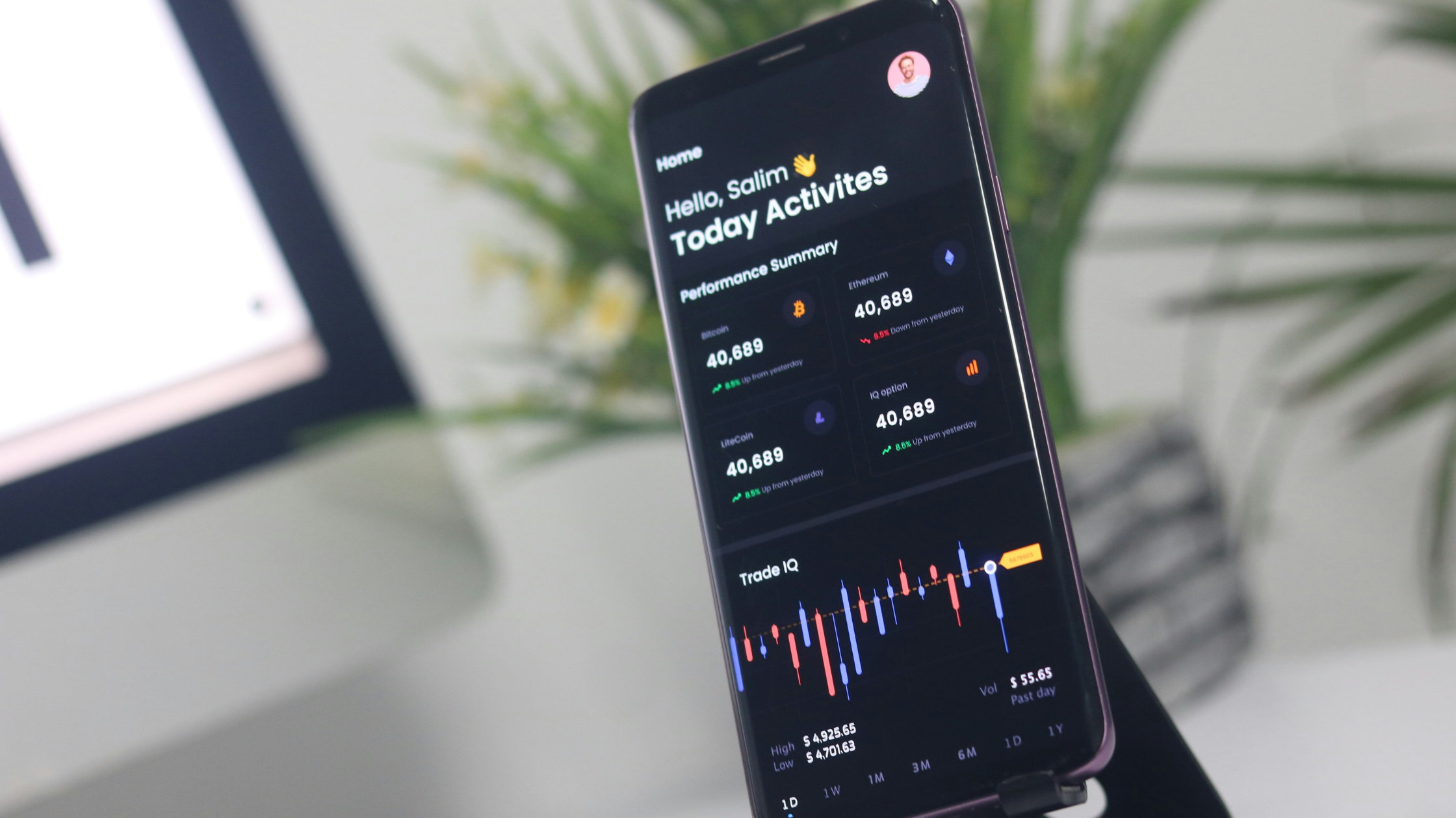 a phone shows a trading app
