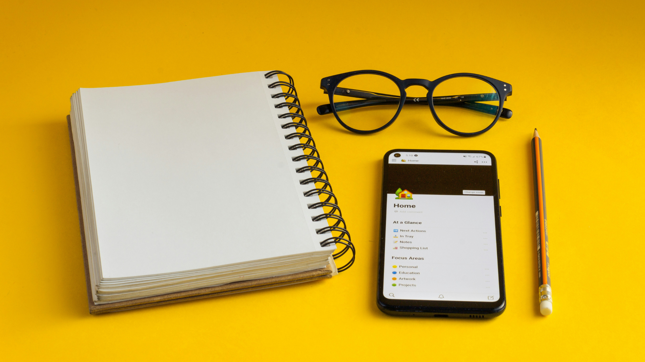 office items against a bright yellow background