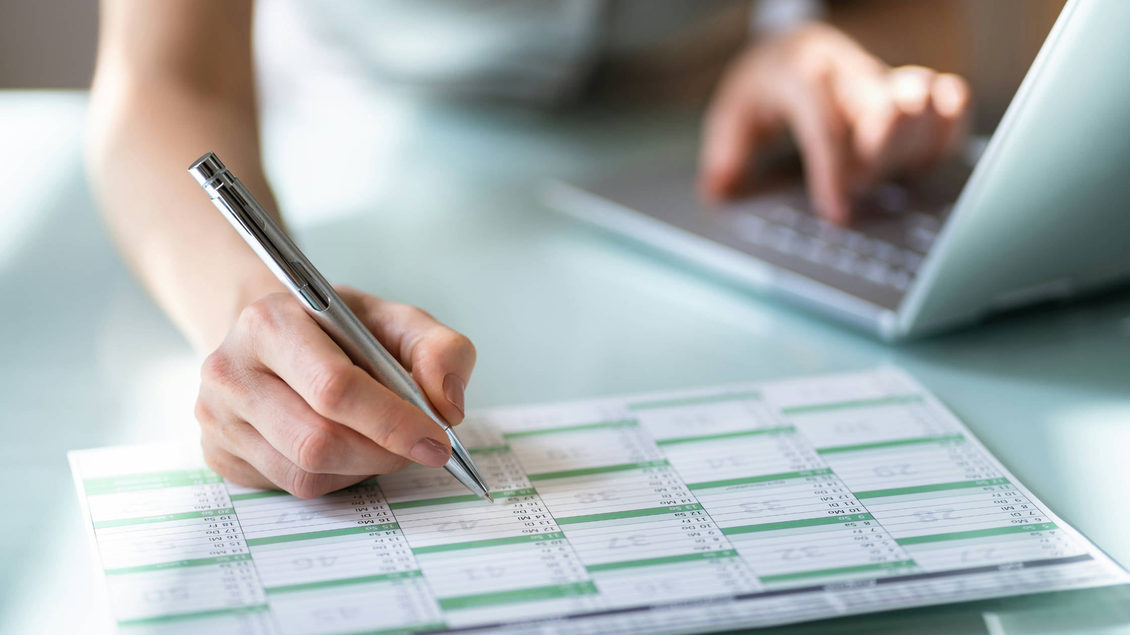 a woman writes in her calendar