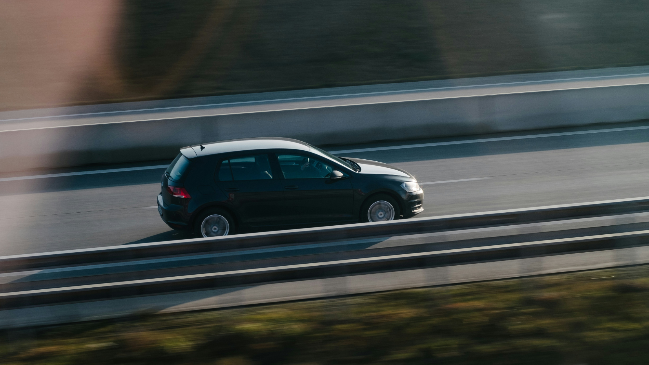 a car speeds along a road
