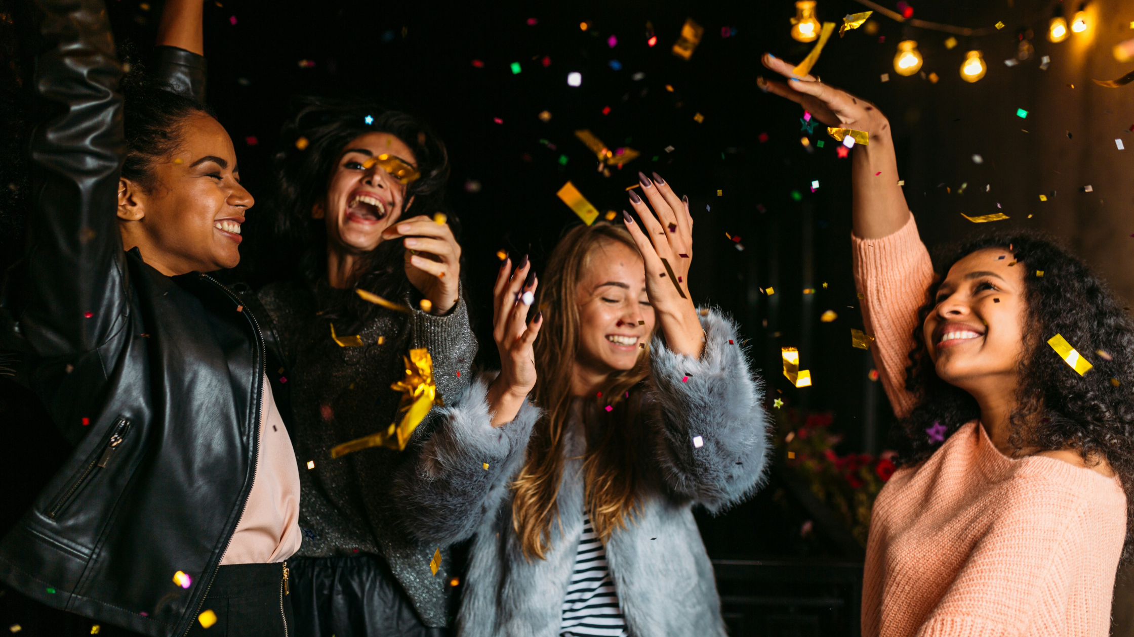 four women celebrating at a party