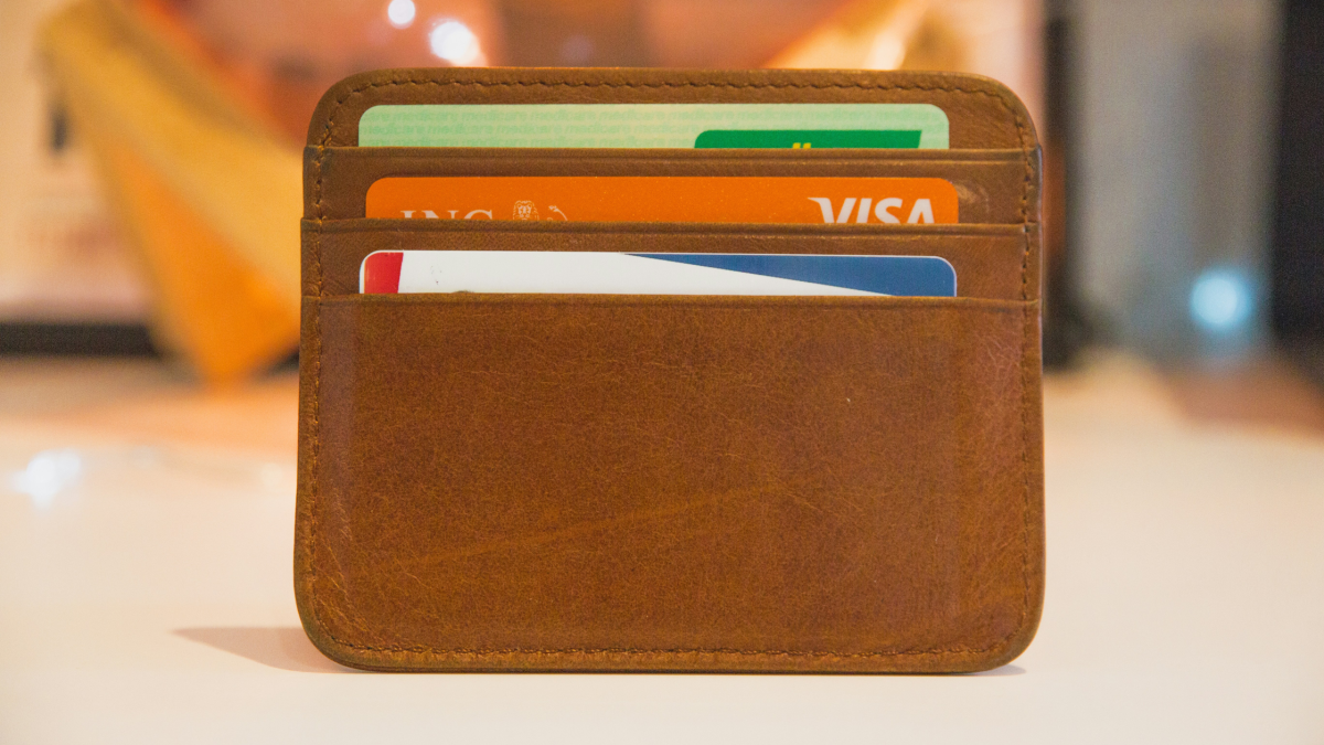 a leather wallet with bank cards in
