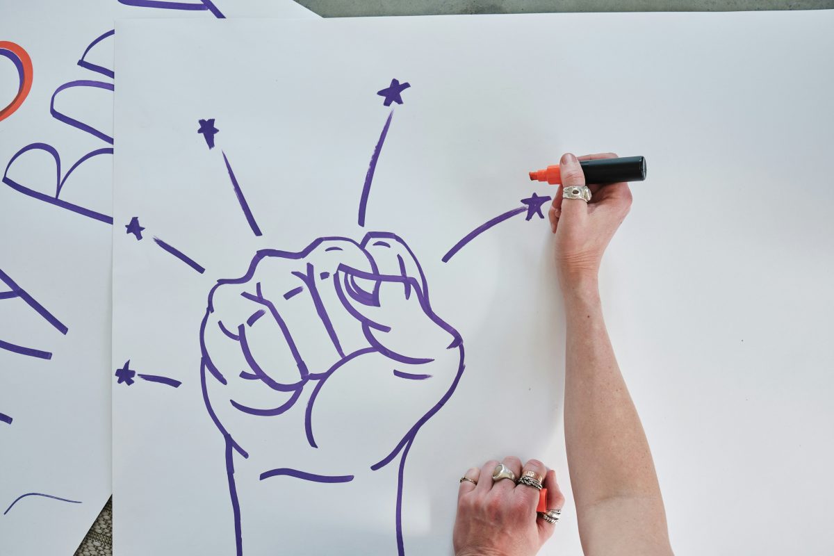 An activist creating a poster