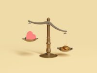 A set of scales with coins on one side and a heart on the other