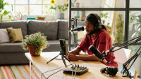 a stylish man is in his podcast studio