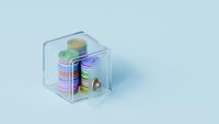 Colourful coins inside a tiny safe