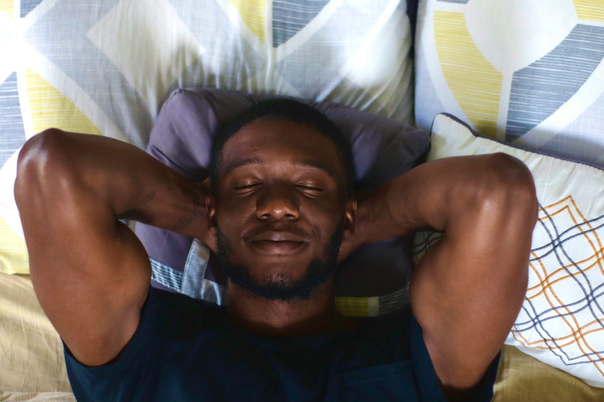 A man lays back, looking calm