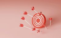 A target board with lots of arrows around the bullseye
